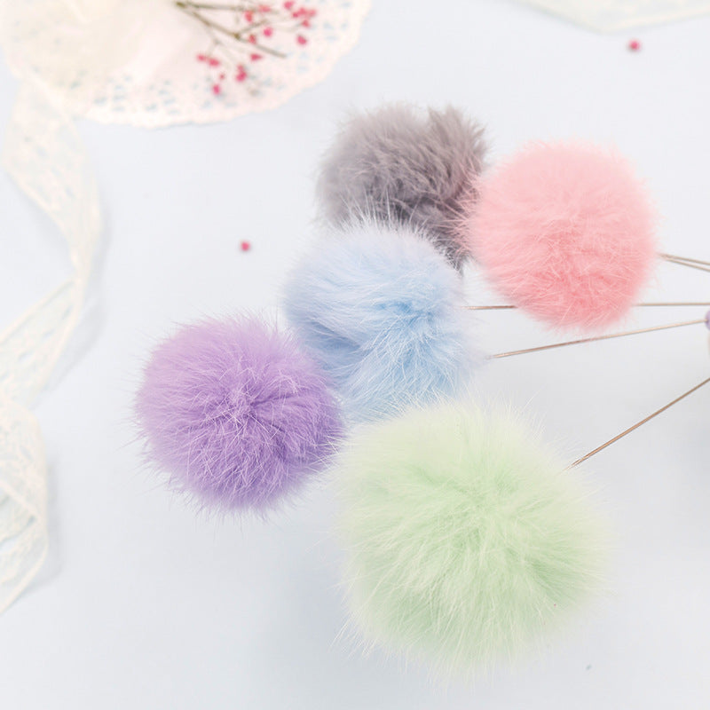 Bunter Pom Pom Katzenangel mit Glockenspielzeug