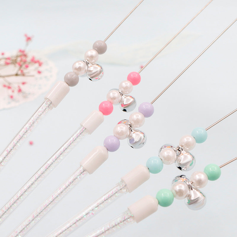 Bunter Pom Pom Katzenangel mit Glockenspielzeug
